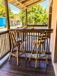 a porch with two chairs and a table at Apartaestudio Privado con cocina in Palomino +15 photos