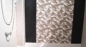 a shower in a bathroom with a shower curtain at Tantawan Place in Roi Et +55 photos