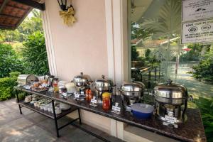 a buffet at a resort with pots and pans at Jacks Resort in Vagator