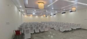 an empty room with white chairs and a white wall at The Van Bagh Ranthambore in Sawāi Mādhopur +34 photos