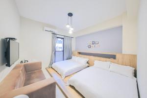 En eller flere senge i et værelse på Starting Point B&B