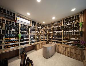 a wine tasting room with a lot of wine bottles at Le Erawan Phang Nga Hotel in Phangnga