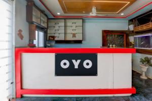 a white and red counter with the ovo sign on it at Hotel O MK2 Hotel and Restaurant in Indore