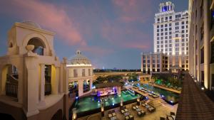 an aerial view of a city at night at Aspen Chalets by Kempinski Hotel Mall of The Emirates in Dubai