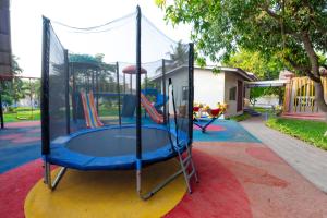 a blue trampoline on a red carpet at Glory of MJ, Family Resort in Nature, Panvel in Panvel