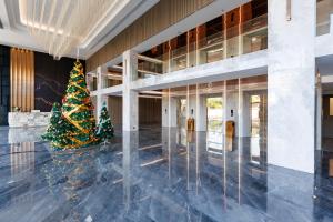 a christmas tree in the lobby of a building at Maritztel Bangkok Hotel in Ban Bang Toei (1)