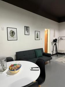 a living room with a table and a couch at EzeApart in Ezeiza