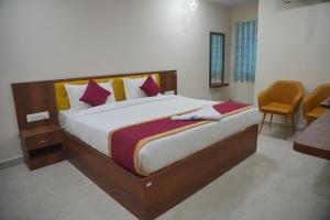 a bedroom with a large bed in a room at Hotel Mount Royale in Hyderabad