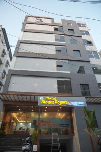 a tall apartment building with a mixtape music venue at Hotel Mount Royale in Hyderabad