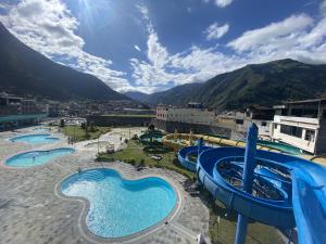 an image of a water park with several pools at Suite Matrimonial 3plz con cocina y garage in Baños +5 photos
