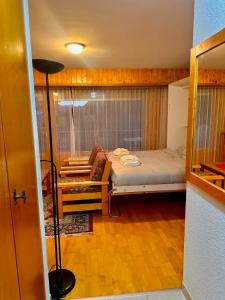 Кровать или кровати в номере Studio SUD - Résidences des Bains d'Ovronnaz - Alpstay S204