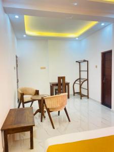 a room with chairs and tables and a ladder at Sky View in Matara +36 photos