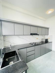 a kitchen with a sink and a counter top at Sky View in Matara