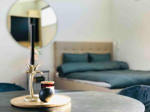 a room with a table with a mirror and a bed at Private apartment with hotel feeling in Hudiksvall