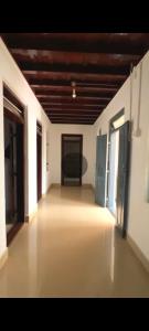 a large room with two doors and a room with a room at The Coffee Cube in Kaniyāmbetta