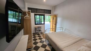 En eller flere senge i et værelse på The Nest 7