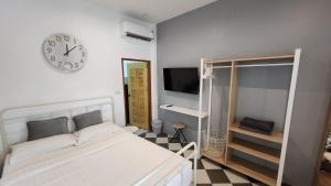 En eller flere senge i et værelse på The Nest 7