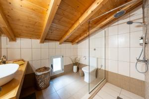 a bathroom with a shower and a sink and a toilet at Casa Sorgente in Ágioi Doúloi +24 photos