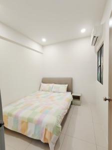 Postel nebo postele na pokoji v ubytování Manhattan Suites Ipoh