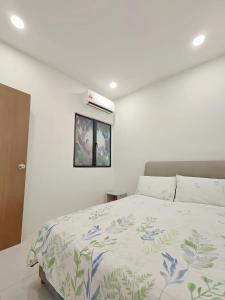 Postel nebo postele na pokoji v ubytování Manhattan Suites Ipoh + 39 fotografií