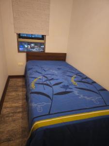 Giường trong phòng chung tại Departamento Tamarugal