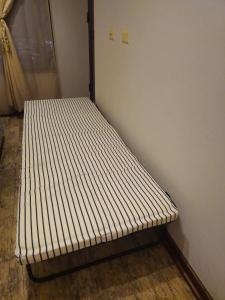 Giường trong phòng chung tại Departamento Tamarugal