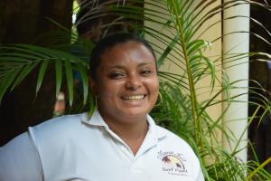a woman standing in front of a plant at Hotel y Restaurante Mama Ines in Santa Catalina +170 photos
