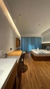 a hotel room with a bed and a bathroom at Bohol panglao Diver's home resort in Panglao