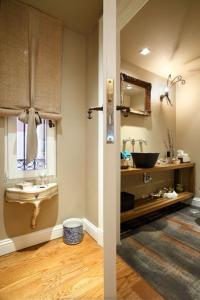 a bathroom with a sink and a mirror at Slow living beautiful villa in Rafina