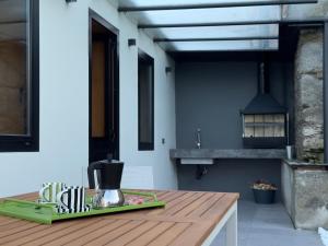 a kitchen with a wooden table with a coffee maker on it at Casa Gafura in Noya +57 photos