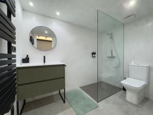 a bathroom with a shower and a sink and a toilet at Casa Gafura in Noya +30 photos