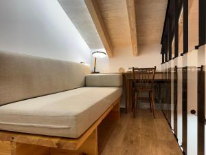 a couch in a room with a table and a chair at Casa Gafura in Noya
