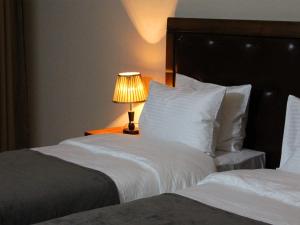 A bed or beds in a room at Rogalux Blue