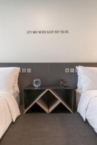 Postel nebo postele na pokoji v ubytování Hotel Cappuccino