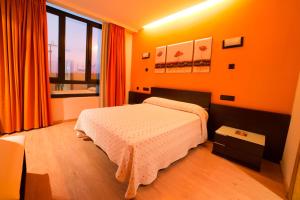 Postel nebo postele na pokoji v ubytování Motel Acropolis