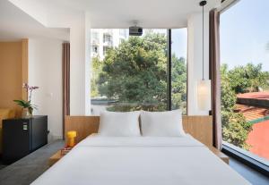 En eller flere senge i et værelse på Bach Plateaus Hotel