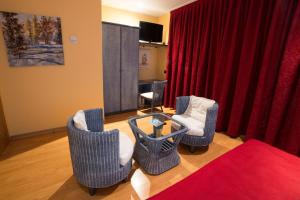 TV a/nebo společenská místnost v ubytování Motel Acropolis
