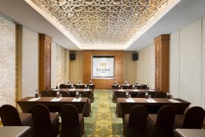 a room with rows of tables and chairs at Padma Resort Ubud in Payangan +50 photos