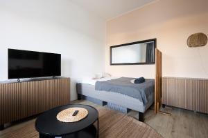 En eller flere senge i et værelse på Beautiful Studio Apt in the Heart of Turku