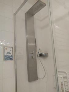 a shower in a bathroom with a glass door at Exceptionnelle vue front de mer avec accès direct plage in Saint Malo