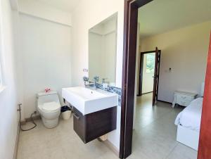 a bathroom with a sink and a toilet at Blue Cove Pool Villa - by KohChangVillas in Trat +15 photos