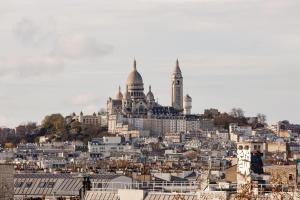 a view of a city with buildings in the background at Hôtel de la Comète in Paris