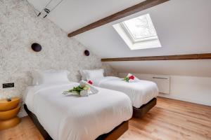 En eller flere senge i et værelse på Maisons Alfort 7 - Large modern family flat + 9 billeder