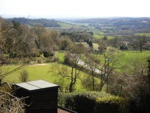 a view of a field with sheep in the distance at 1 Bed in Ampleforth oc-b34674 in Ampleforth