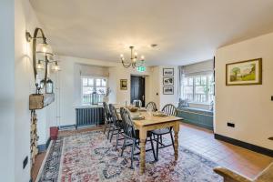 a dining room with a table and chairs at 3 Bed in Neath oc-p34366 in Neath