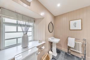 a bathroom with a vase on a counter and a sink at 3 Bed in Neath oc-p34366 in Neath +26 photos