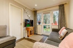 a living room with a couch and a tv at 2 Bed in Penzance oc-m27232 in Gulval