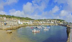 a group of boats in a river in a town at 2 Bed in Penzance oc-m27232 in Gulval