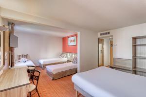 En eller flere senge i et værelse på Ace Hotel Troyes