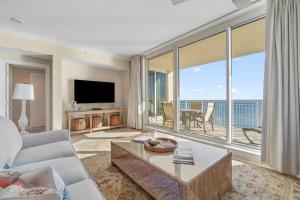 a living room with a view of the ocean at Indigo West 1404 in Perdido Key